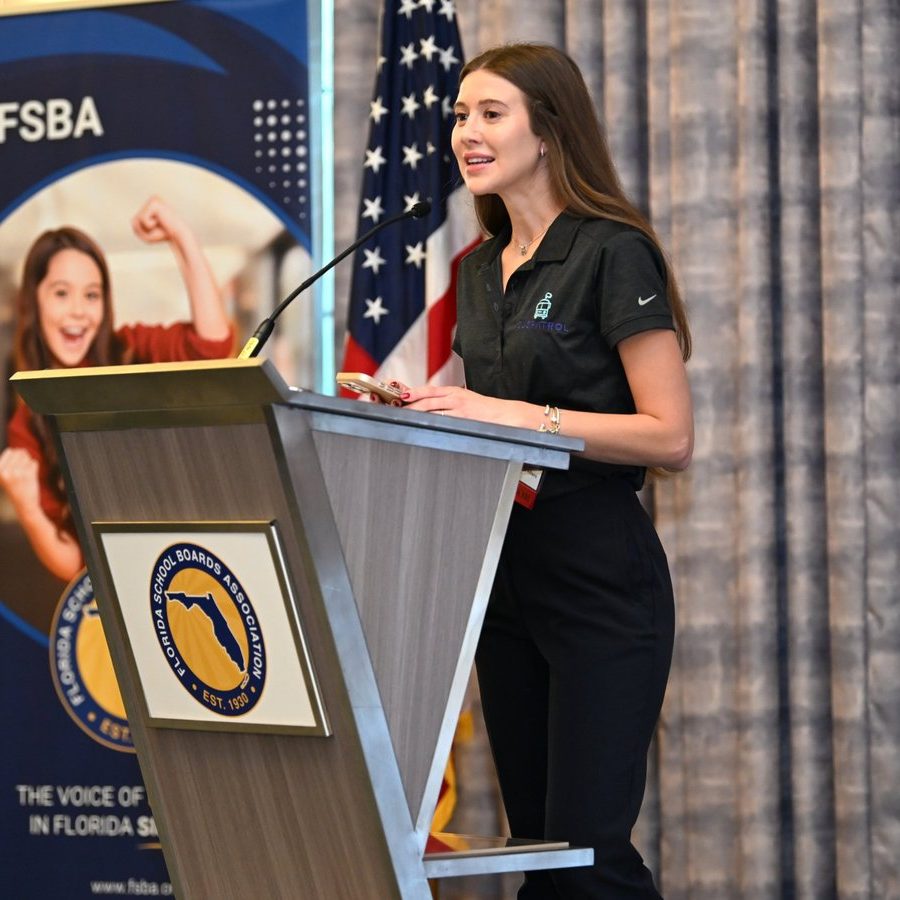 Sponsor speaks at the podium